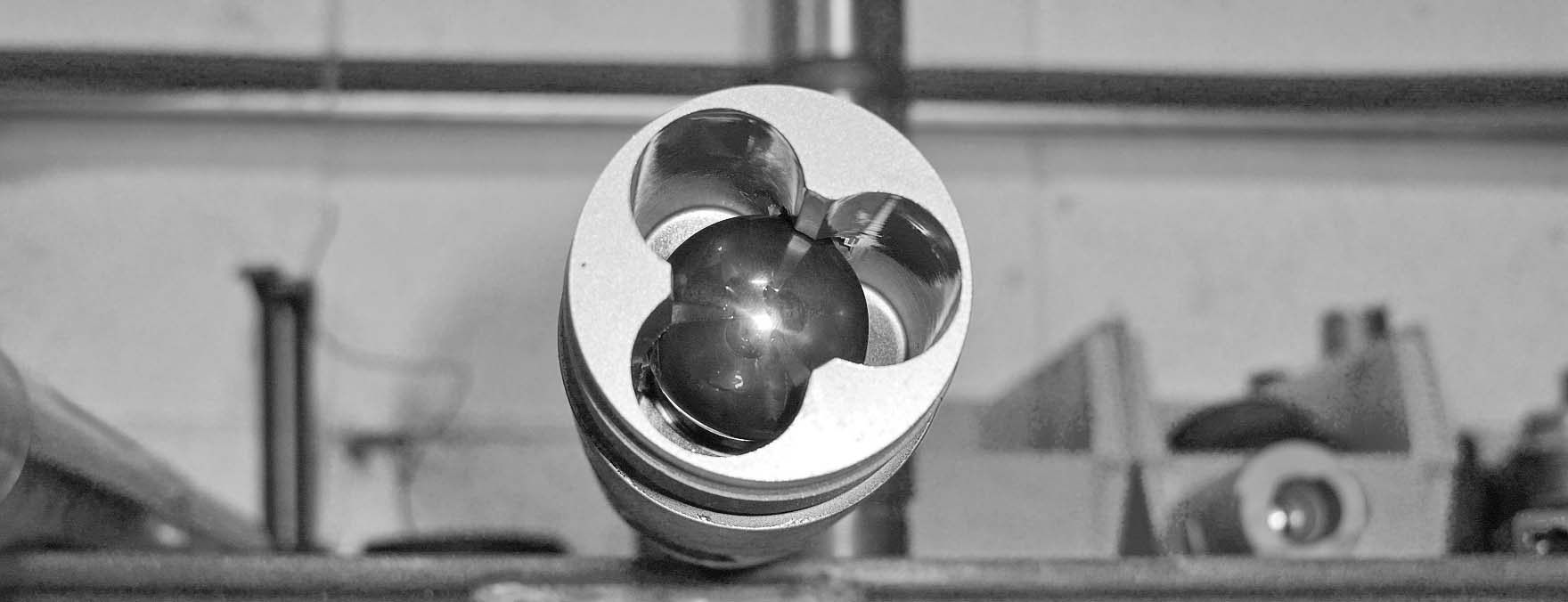 Ball and seat valve of a sucker rod pump, black and white